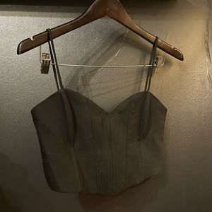 A black Zara cropped corset top with strapped.